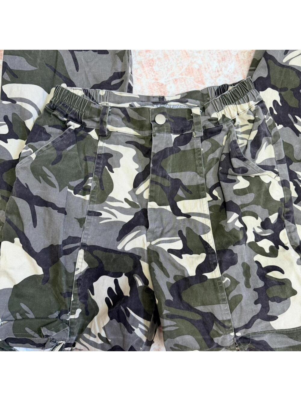 Camo cargo/parachute style pants with utility details and adjustable ankle ties